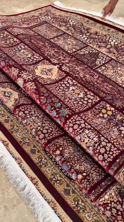 Burgundy carpet with a panel design